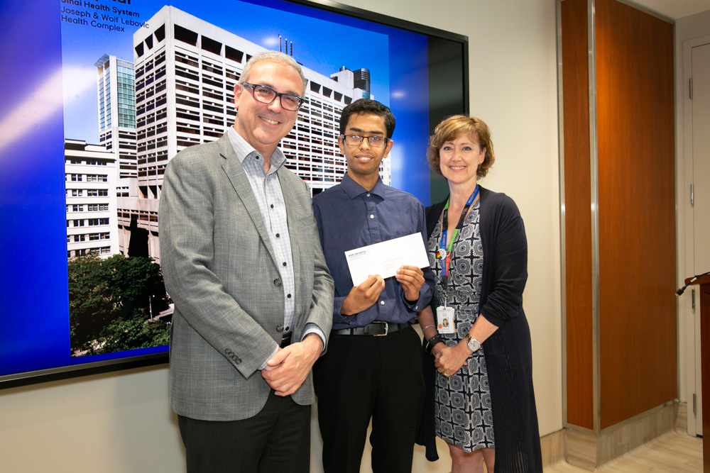 Dr. Gary Newton CEO with Diamond Jubilee Scholarship recipient Adnan Moinuddin (centre) and Lynn Ardizzi, Senior Director, Organizational Development & People Engagement