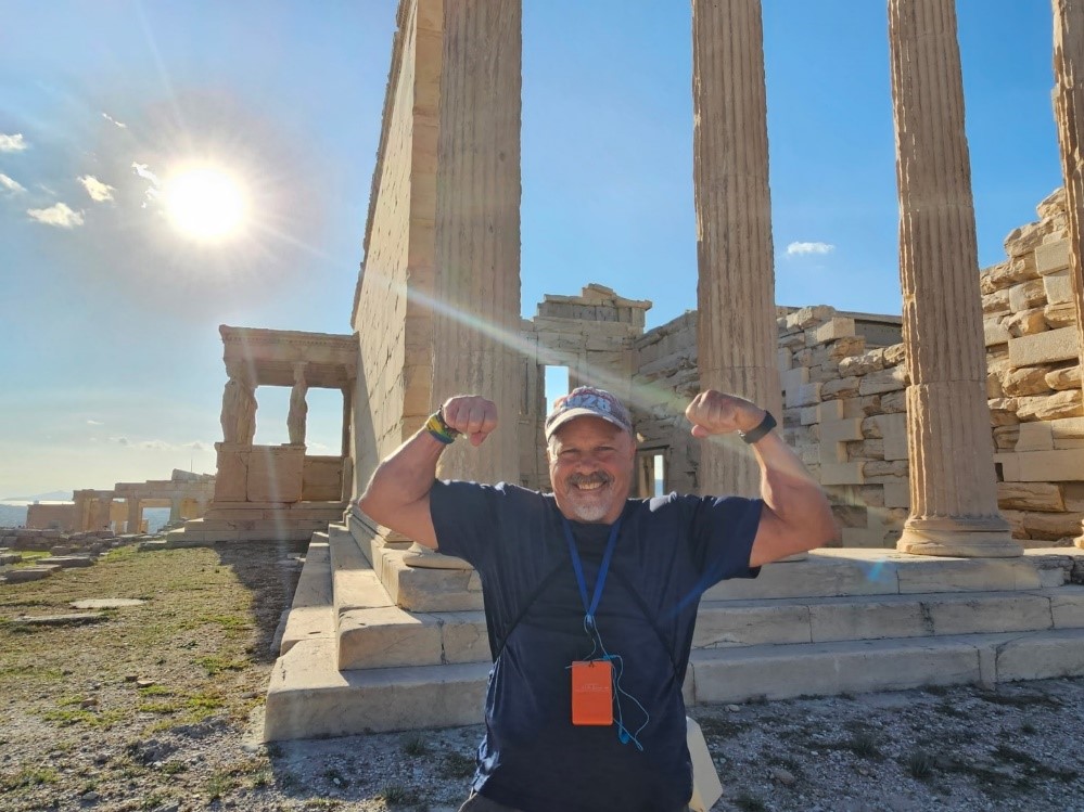Jeff standing in front of ruins in Greece in 2023.