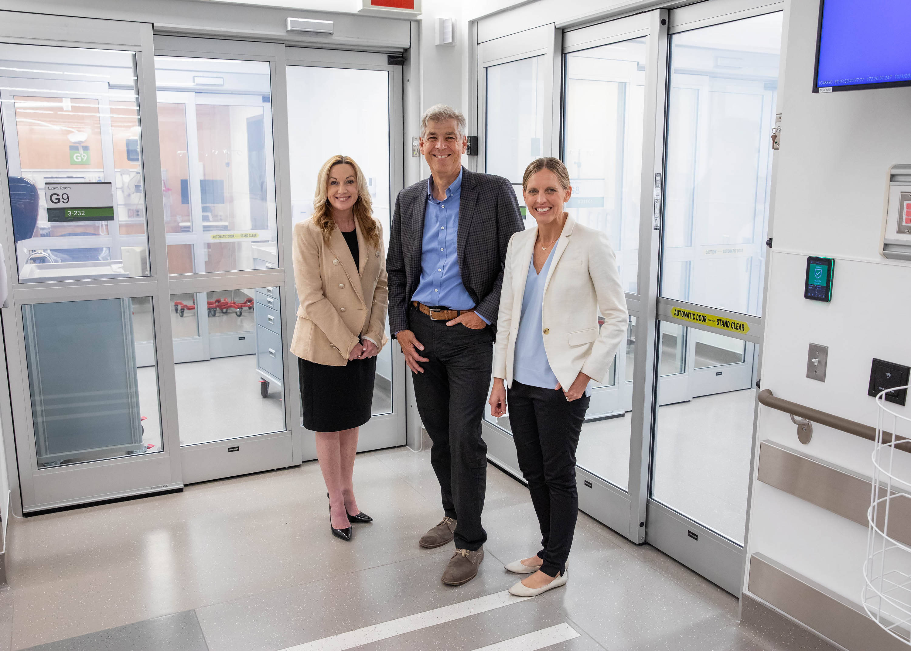 three physicians standing in a hallway