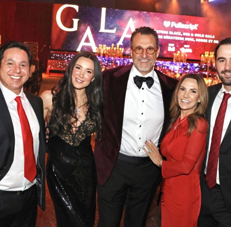 Five people at a formal gala
