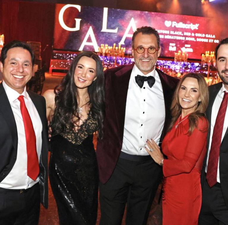 Five people at a formal gala