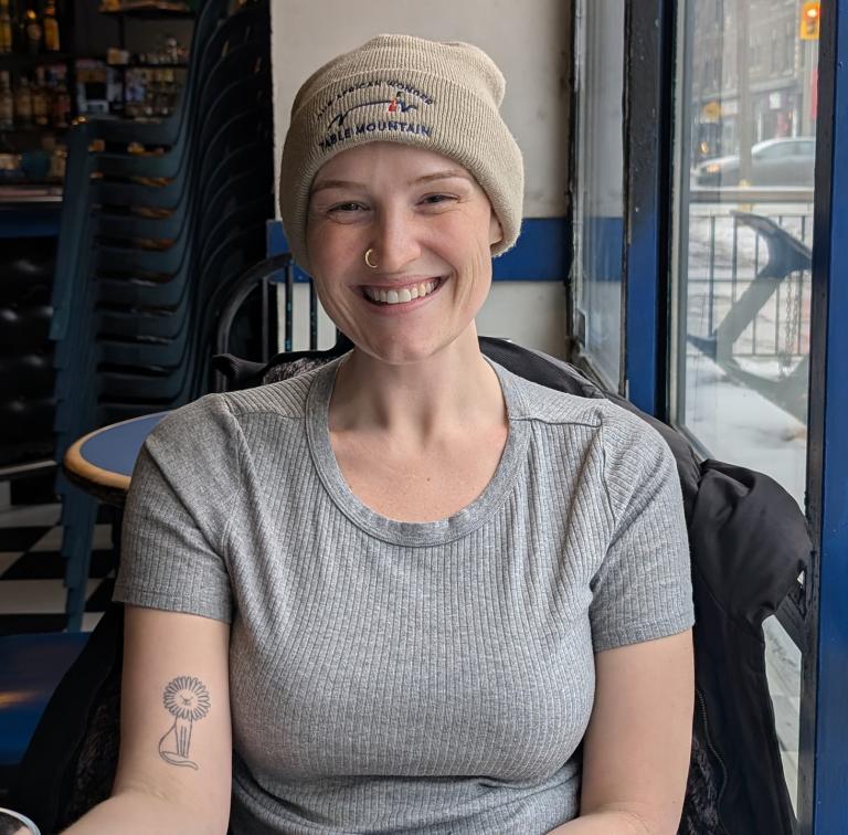 woman sits in cafe