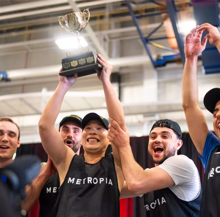 Group of excited young men celebrating winning a basketball tournament