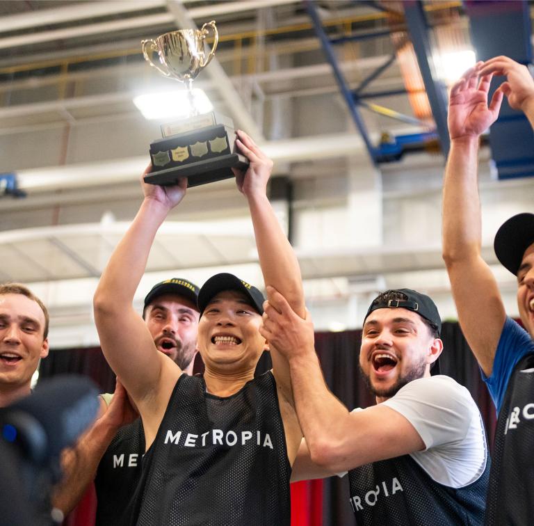 Group of excited young men celebrating winning a basketball tournament