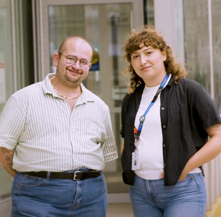 two people standing outside 