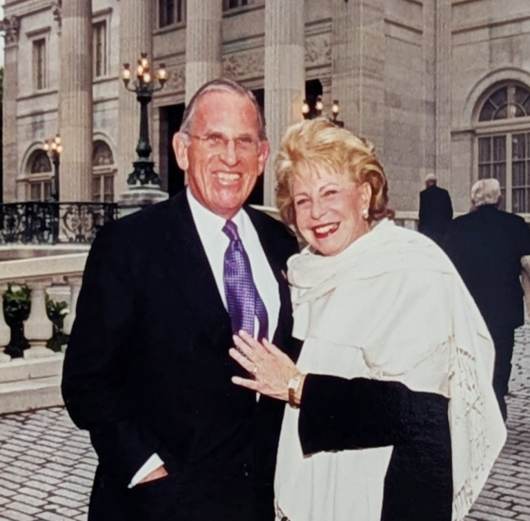 man and woman standing together outside