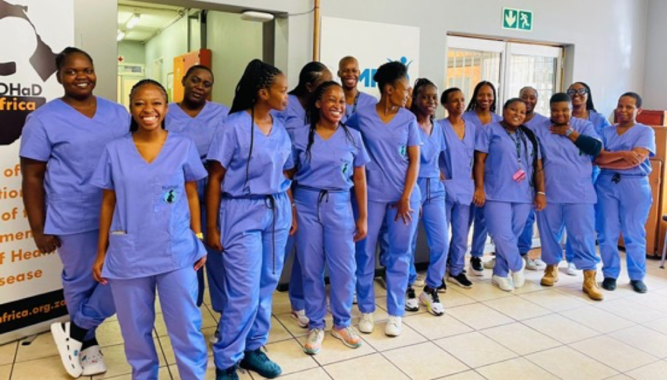 A group of South African healthcare workers wearing scrubs