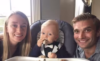 Steve Thompson with partner and baby.