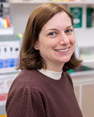 Dr. Alissa Greenwald smiling in the lab. 