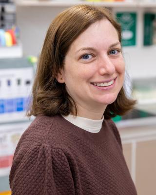 Dr. Alissa Greenwald smiling in the lab. 
