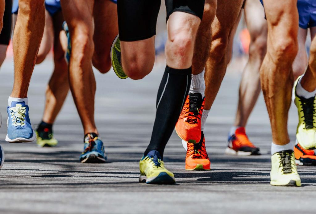 Legs of people running