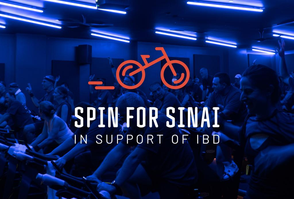 spin for sinai logo in foreground with people on spin bikes in the background