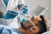 A respiratory therapist performs a breathing test