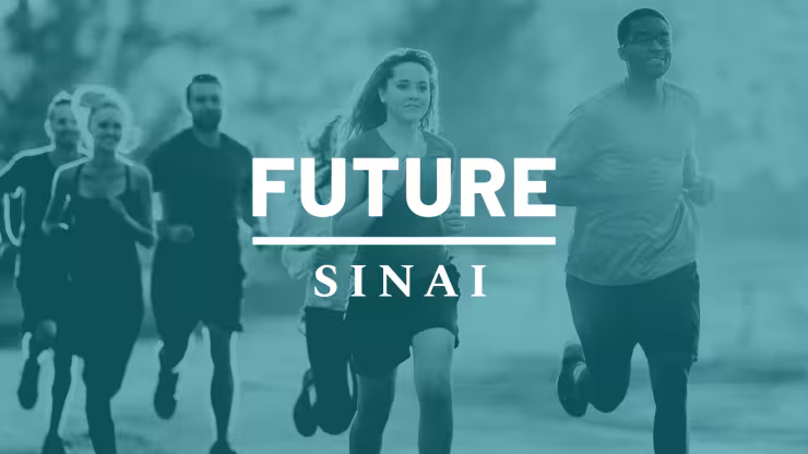 A group of six people running together outdoors, moving as a group for a run or fitness activity.