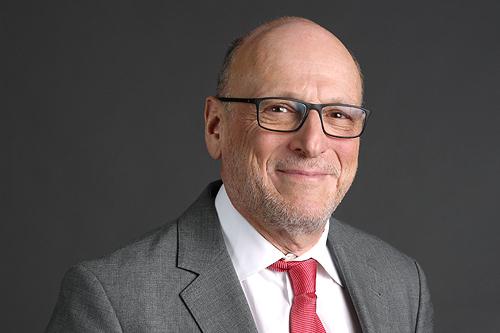 An older man smiling
