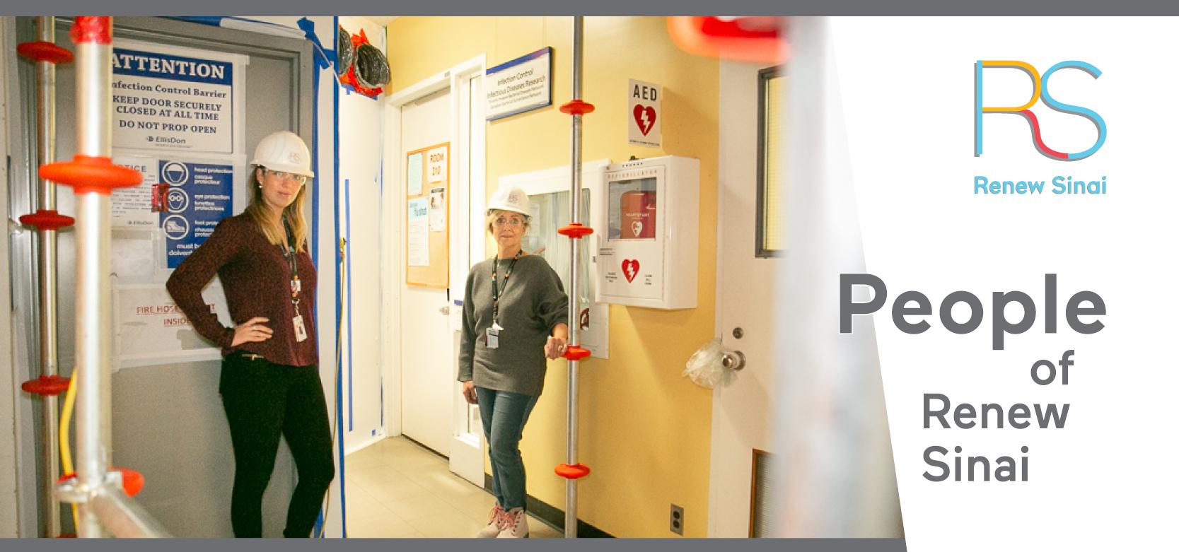 2 female Sinai Health employees wearing hard hats standing in a construction area within Mount Sinai Hospital
