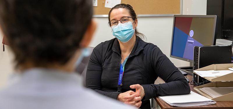 Dr. Erin Kennedy speaks with a patient.