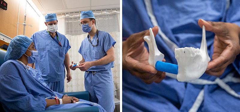 Photo of surgeons with patient who is all gowned up holding a 3D printed version of her jaw.