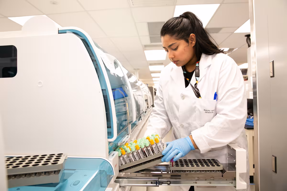Mount Sinai Department of Pathology and Laboratory Medicine employee collecting patient samples.