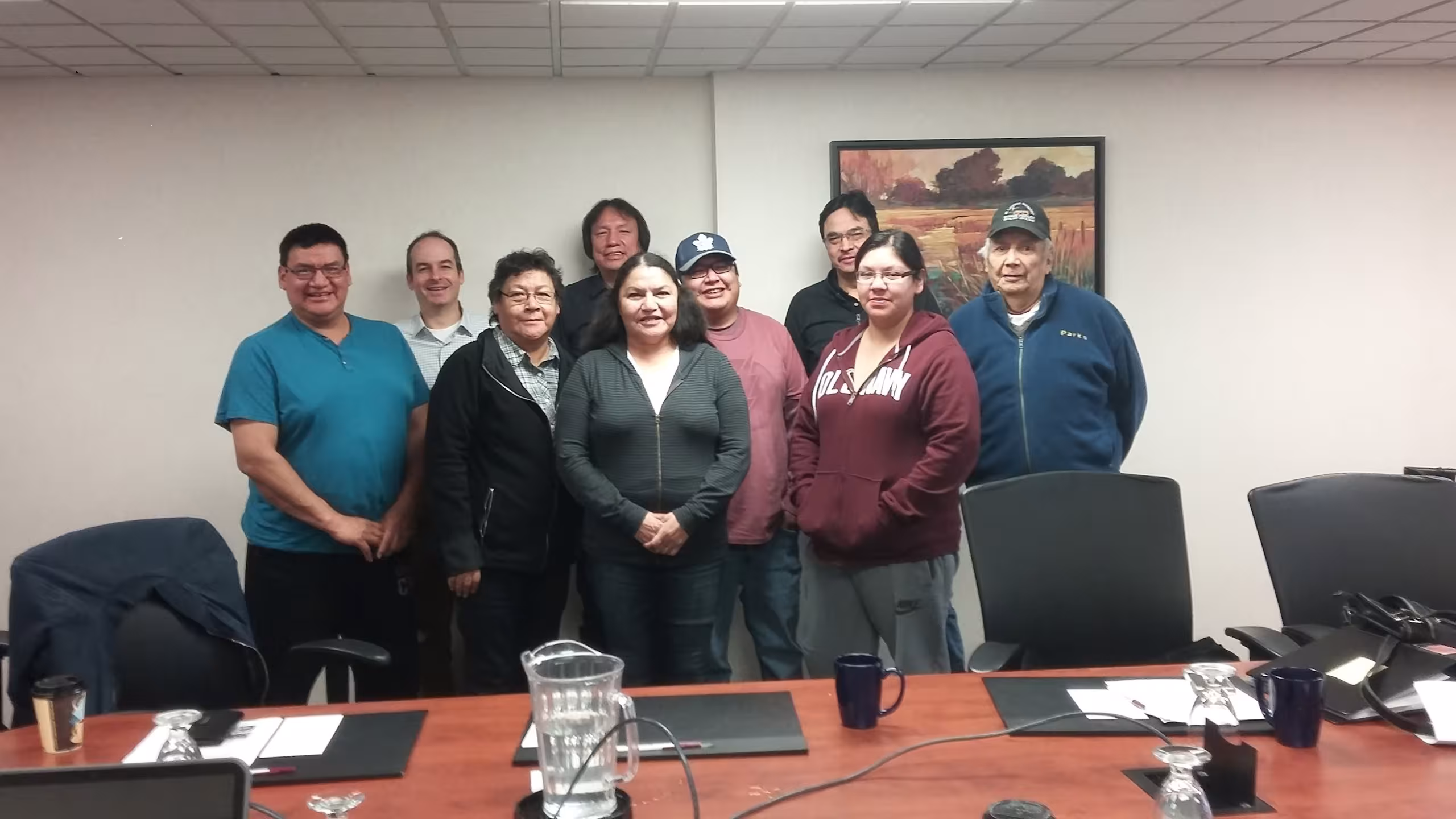 group of people stand in meeting room
