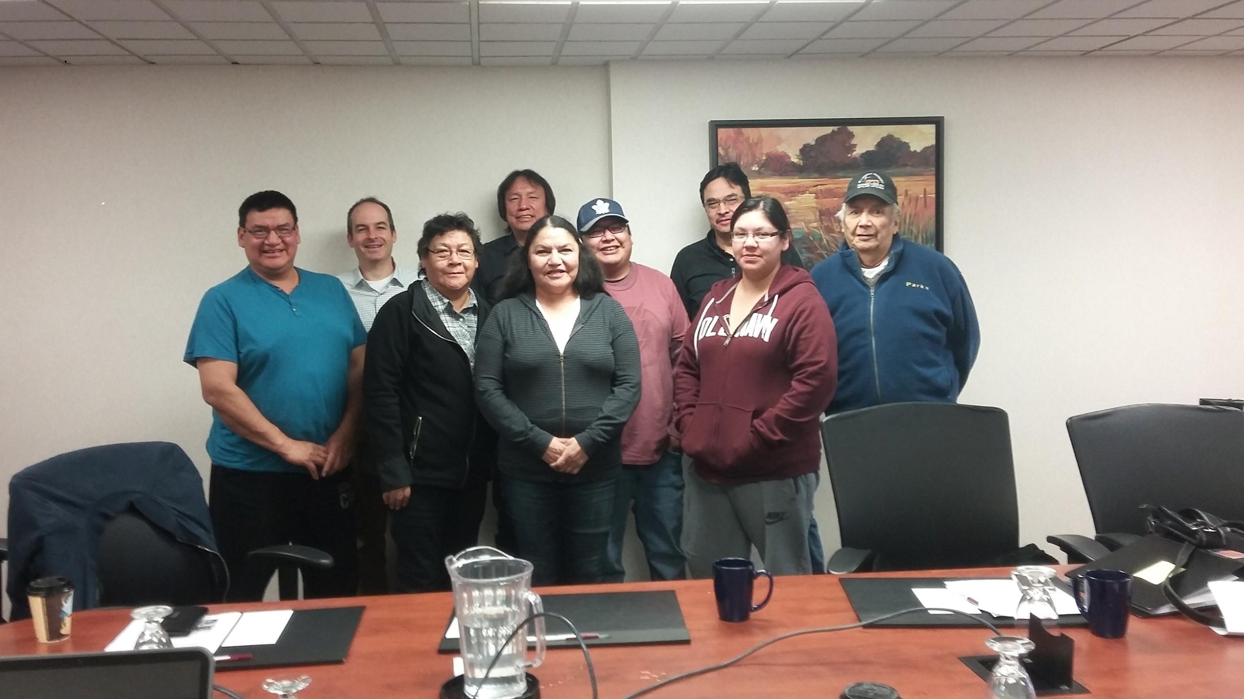 group of people stand in meeting room