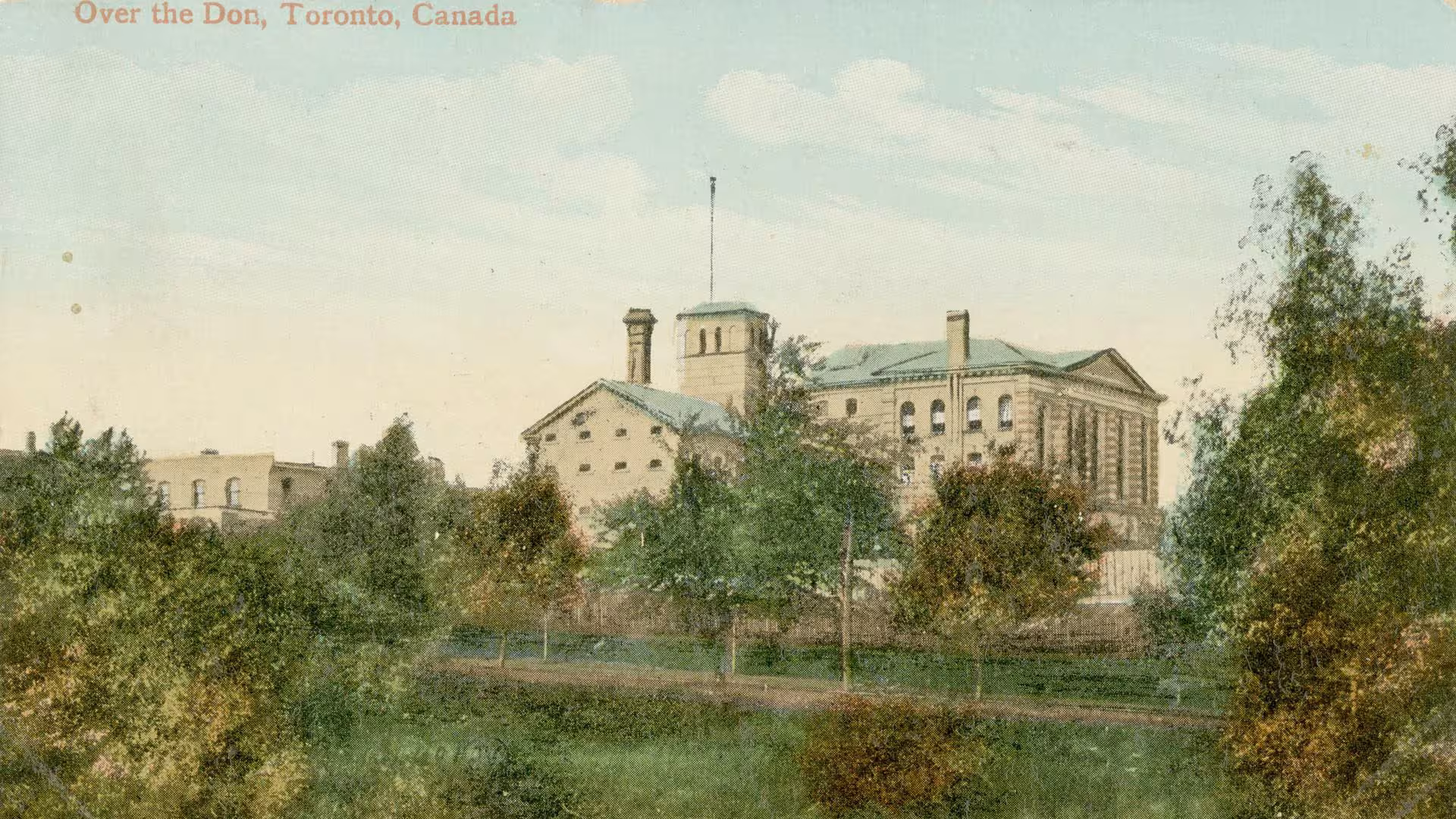 An illustration of a large building made of light gray brick with a green roof. In the foreground are trees of various shades of green.