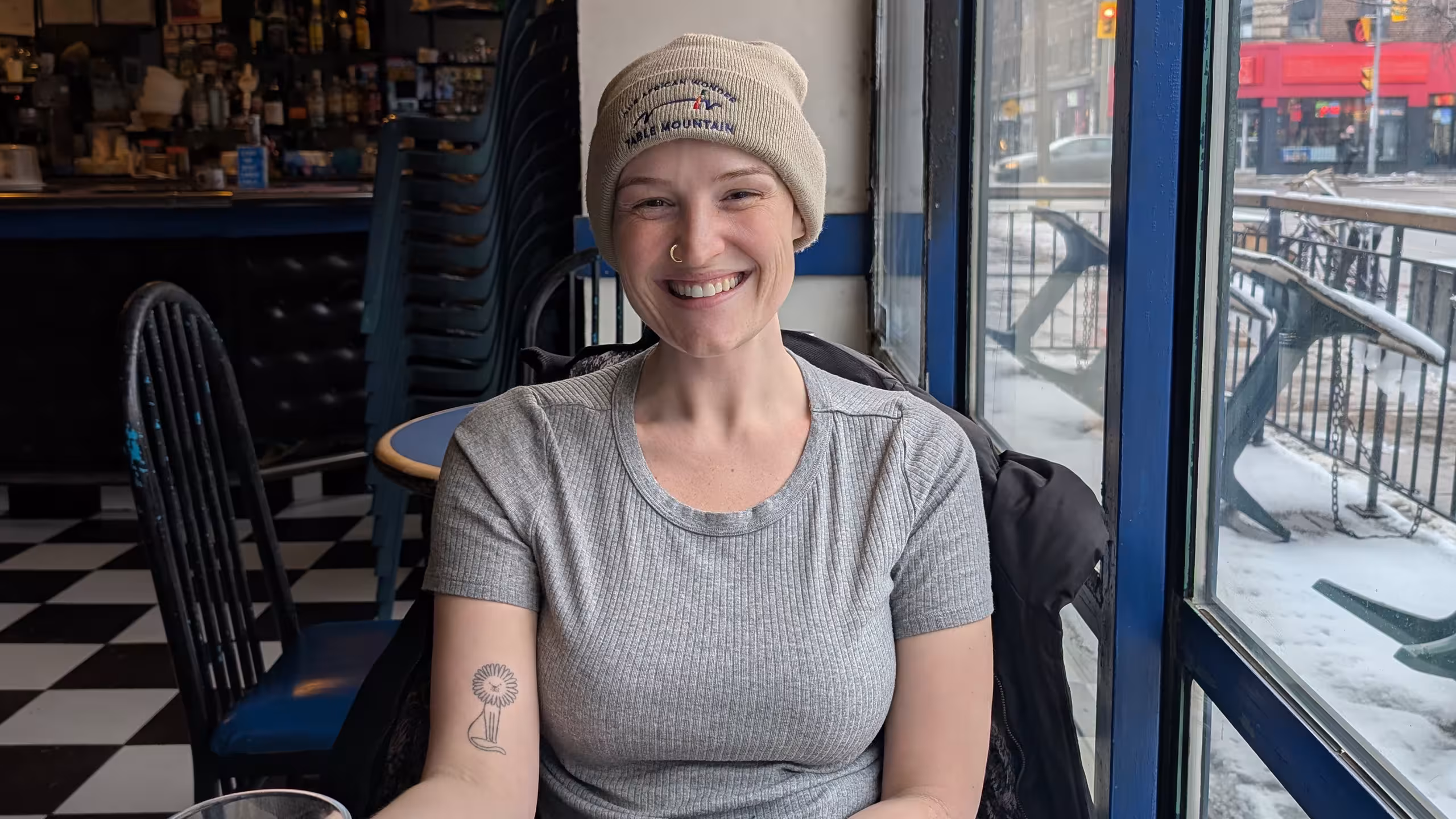 woman sits in cafe