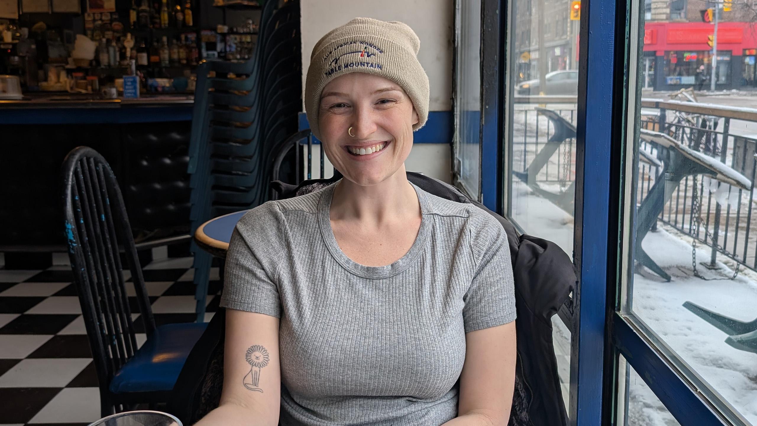 woman sits in cafe
