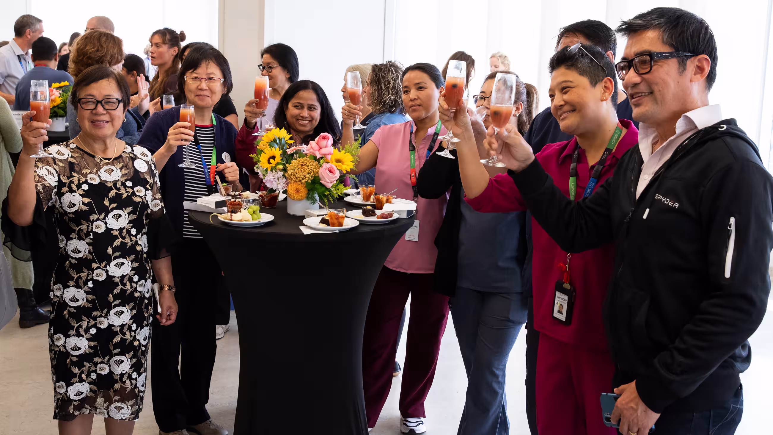 People raising a glass together at Sinai Health’s Service Celebration.