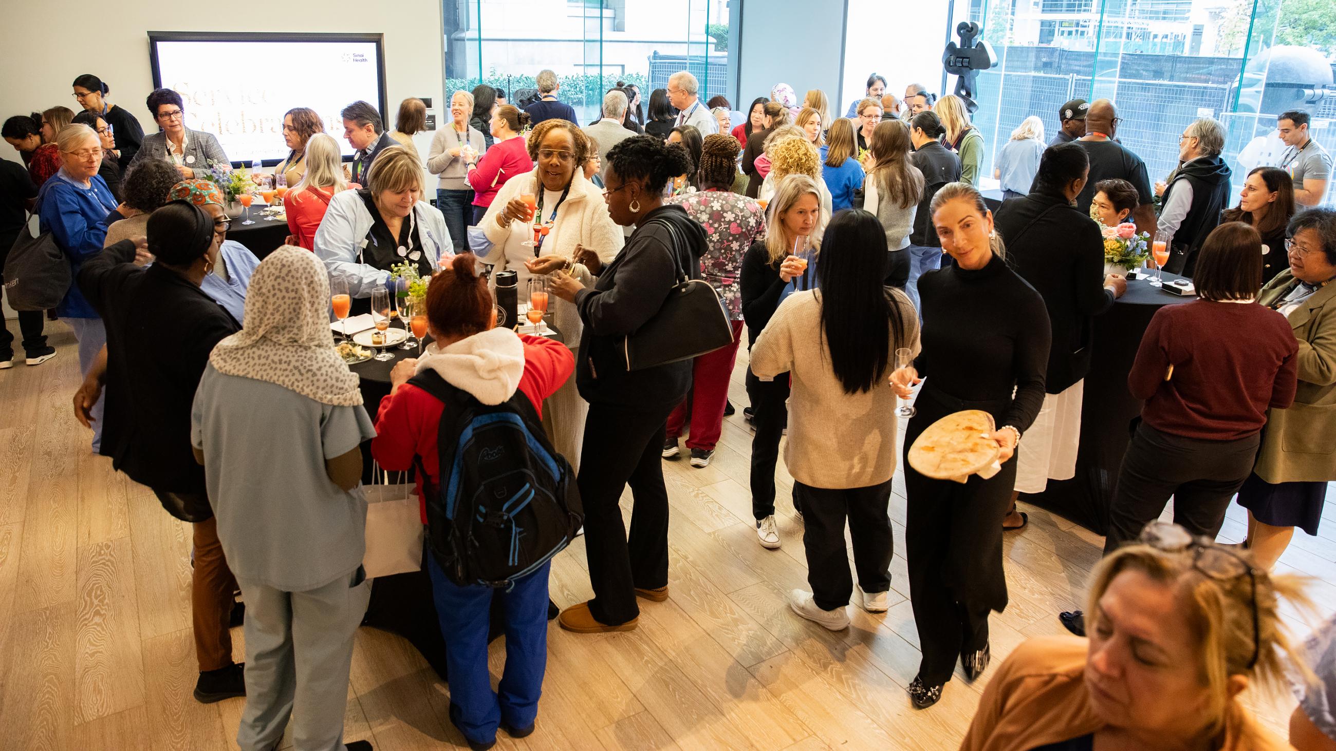 People celebrating together at Sinai Health’s Service Celebration.