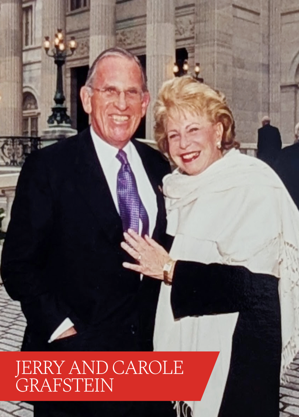 Smiling man and woman. Red banner with white text reads Jerry and Carole Grafstein