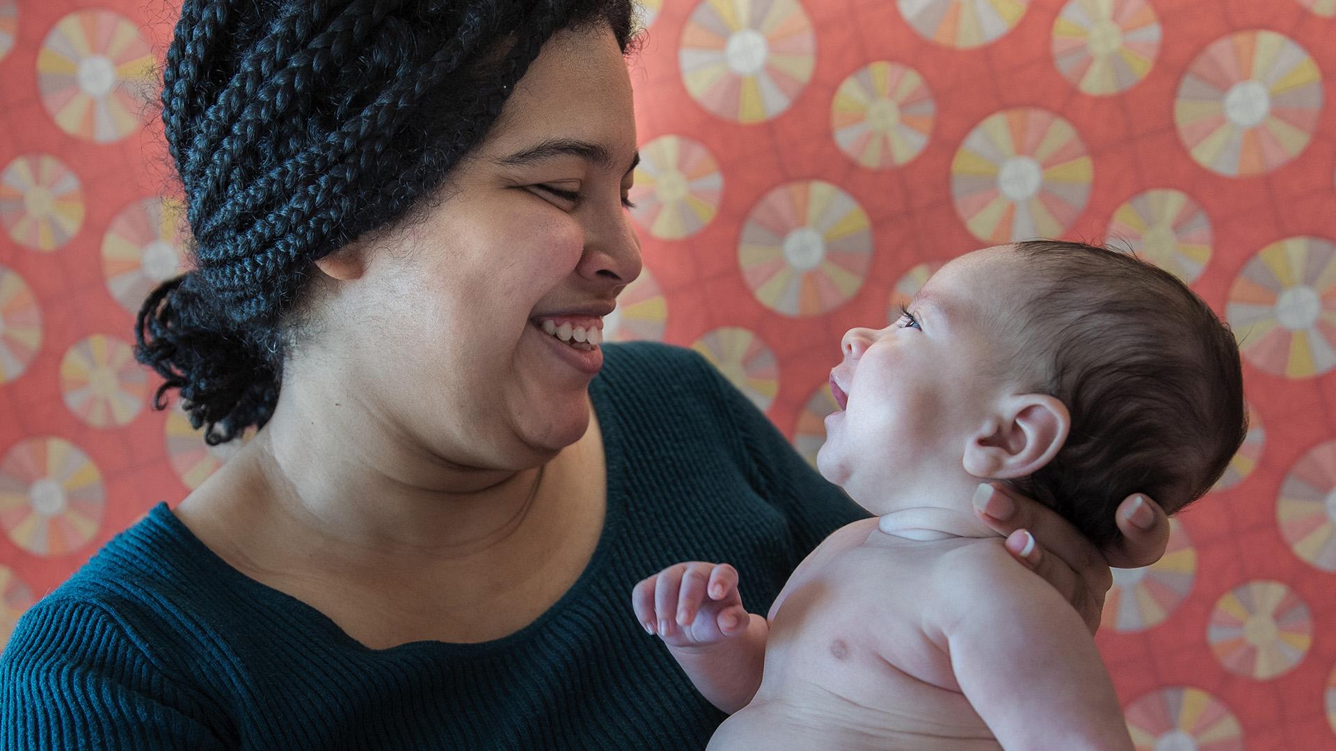 Mother, Grismaris, holding her baby boy, David.