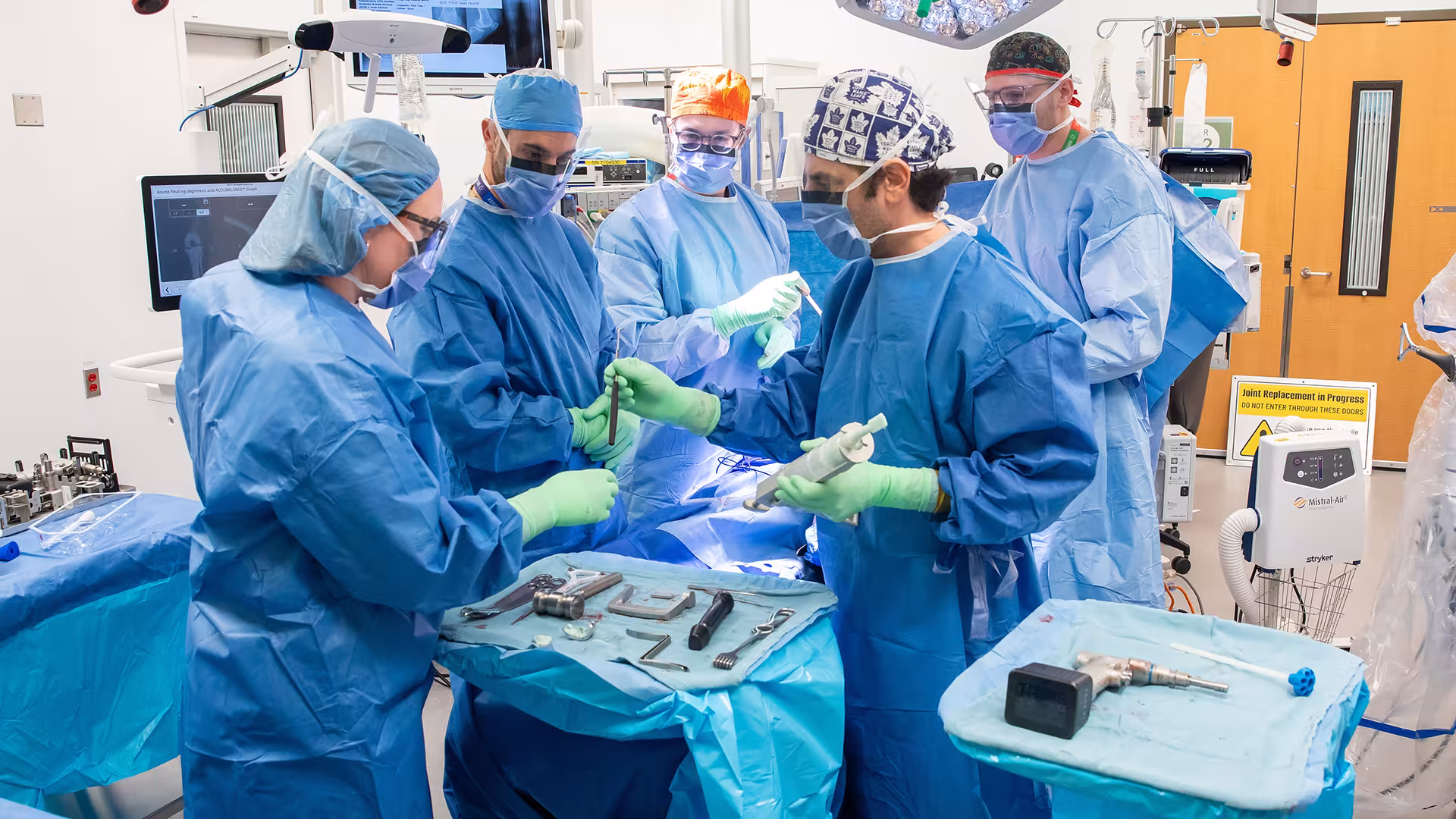 Members of the surgery team performing a procedure.