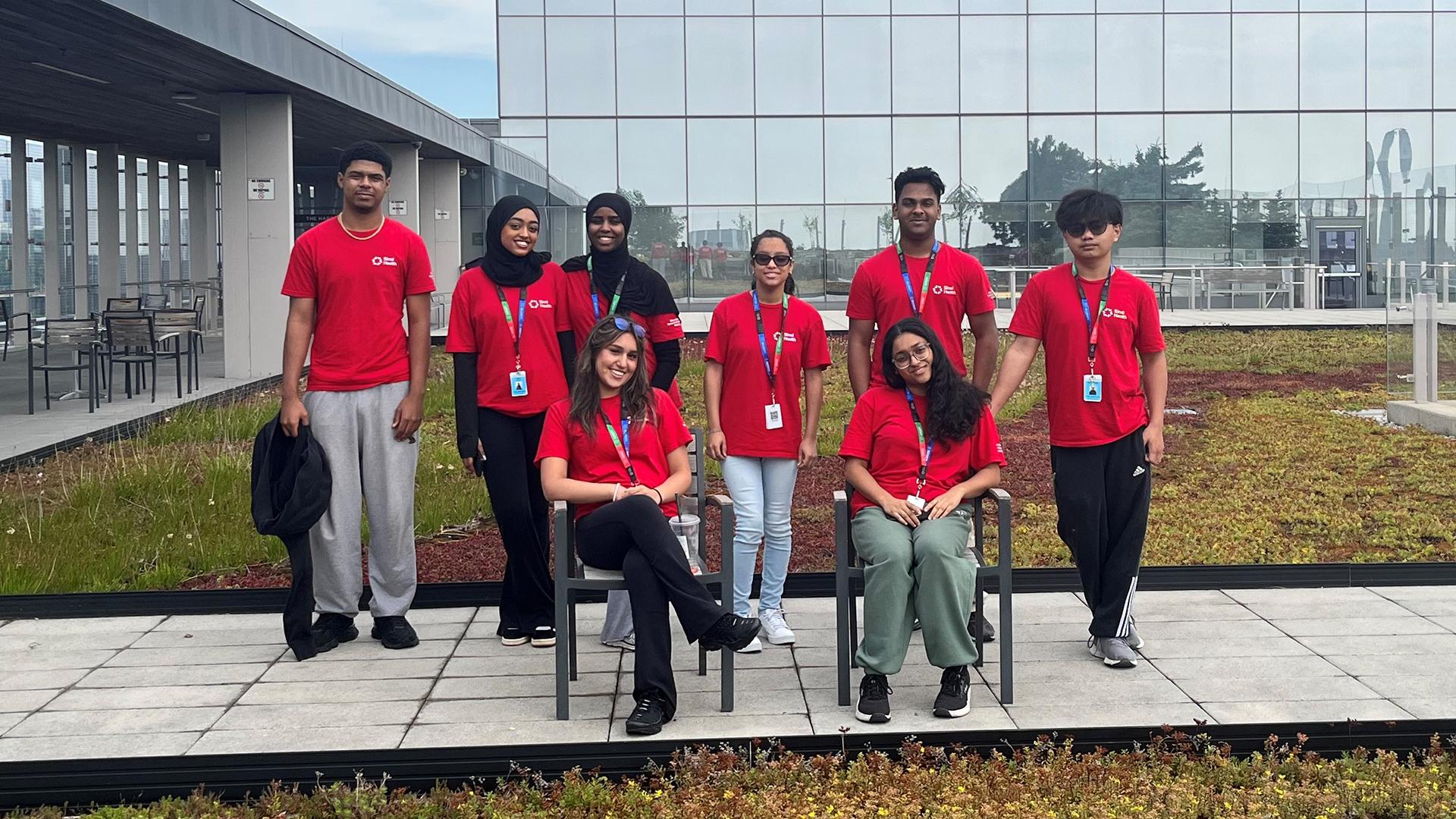 Toronto Community Housing co-op volunteers pose on the rooftop garden at Hennick Bridgepoint Hospital.