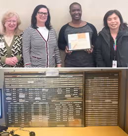 Two photos one above the other. The top is a photo of a group of four women who work in the admitting department at the hospital, they are standing next to each other looking at the camera, smiling. One is holding a picture frame with old documents in it. The second photo is a photo of a board used to track admissions to the hospital.