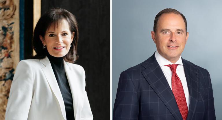 woman wearing white blazer on left, man wearing suit and red tie on right