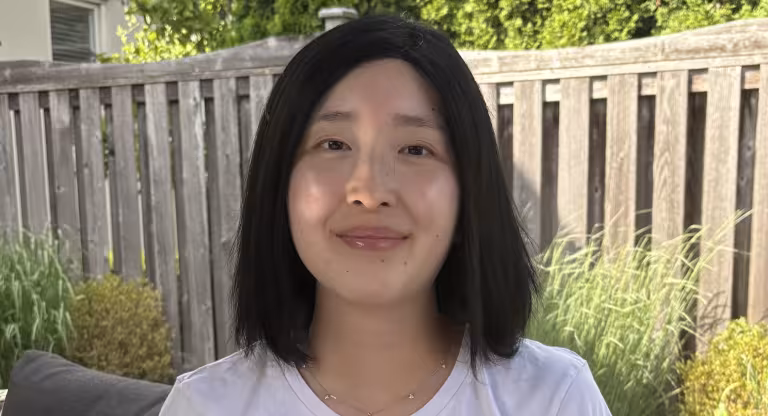 woman sits outside 