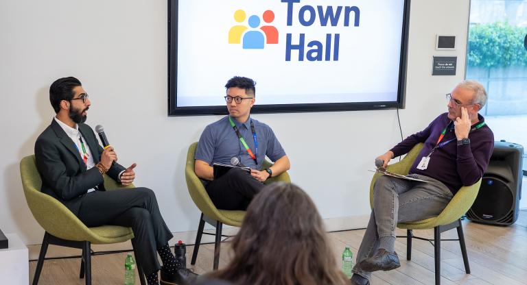 Robin Waley, Michael Palomo and Dr. Gary Newton seated at a Sinai Health Town Hall.