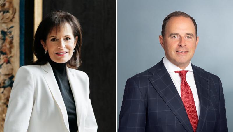woman wearing white blazer on left, man wearing suit and red tie on right