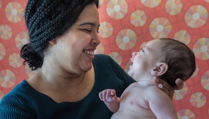 Mother, Grismaris, holding her baby boy, David.