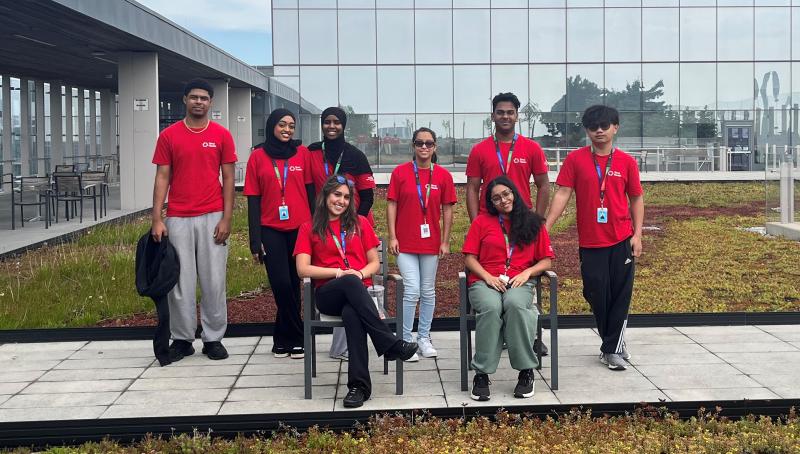 Toronto Community Housing co-op volunteers pose on the rooftop garden at Hennick Bridgepoint Hospital.