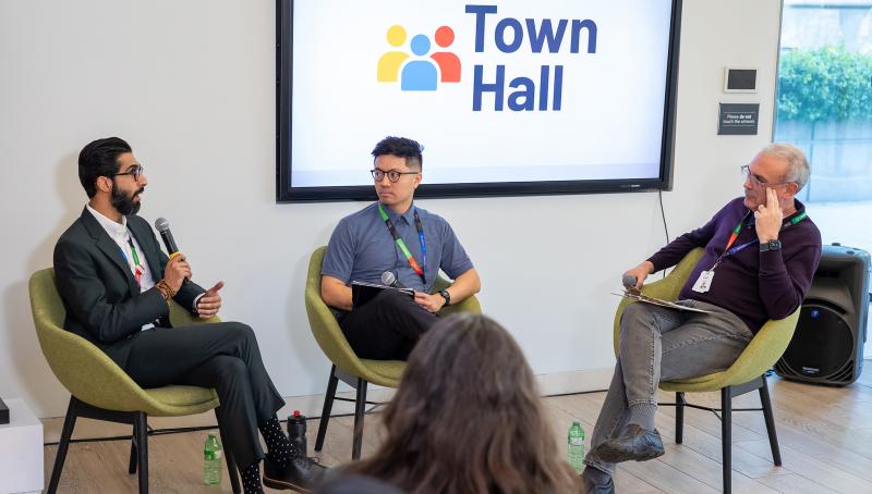 Robin Waley, Michael Palomo and Dr. Gary Newton seated at a Sinai Health Town Hall.