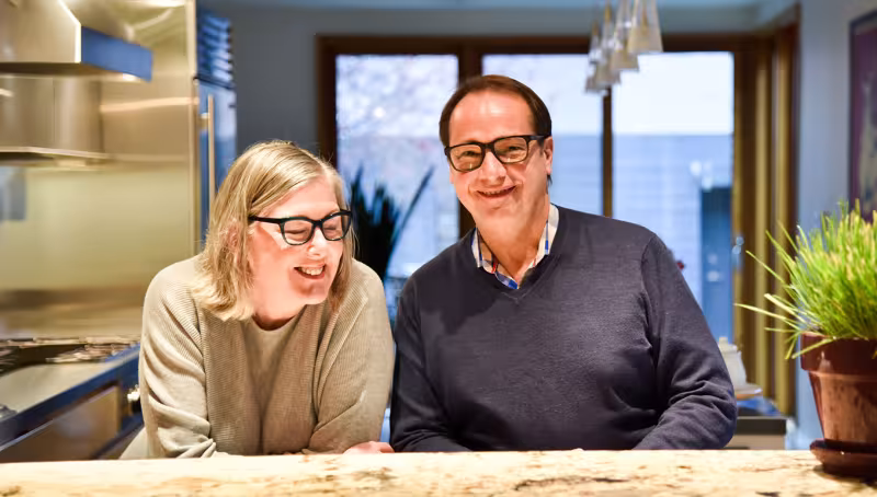 couple smiling in kitchen