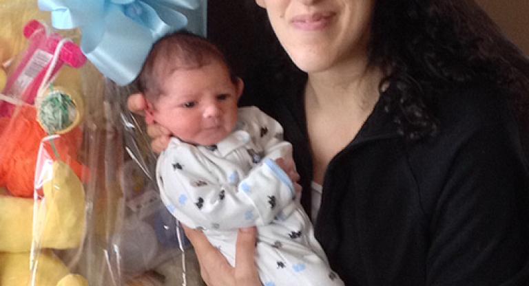 Andrea Querido holding her infant son, Anthony