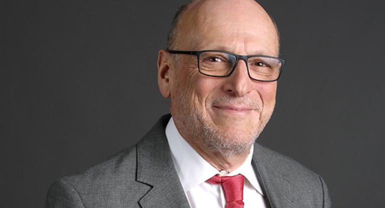 An older man smiling