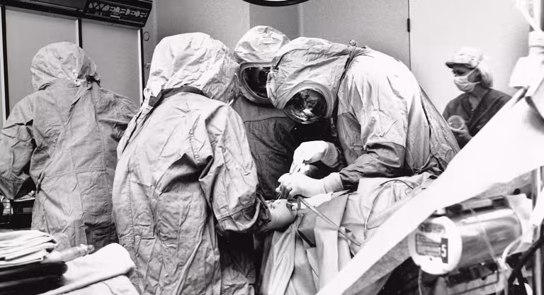 black and white photo of a surgical team operating on a patient
