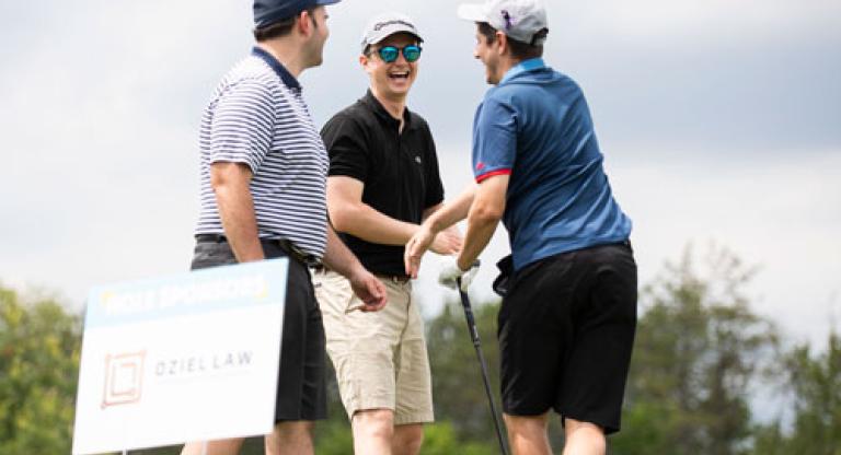 Golfers at the Swing for Sinai gold tournament