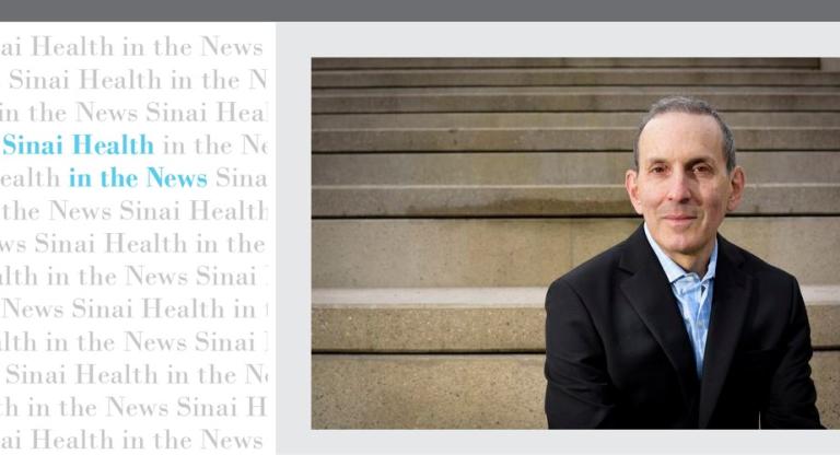 Man in suit sitting on steps with a graphic treatment on the left.