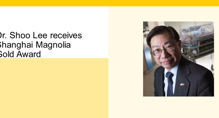 Physician in suit in front of an incubator