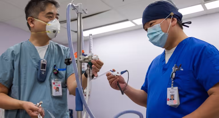 Respiratory Therapist demonstrates equipment used in high flow nasal cannula oxygen therapy 